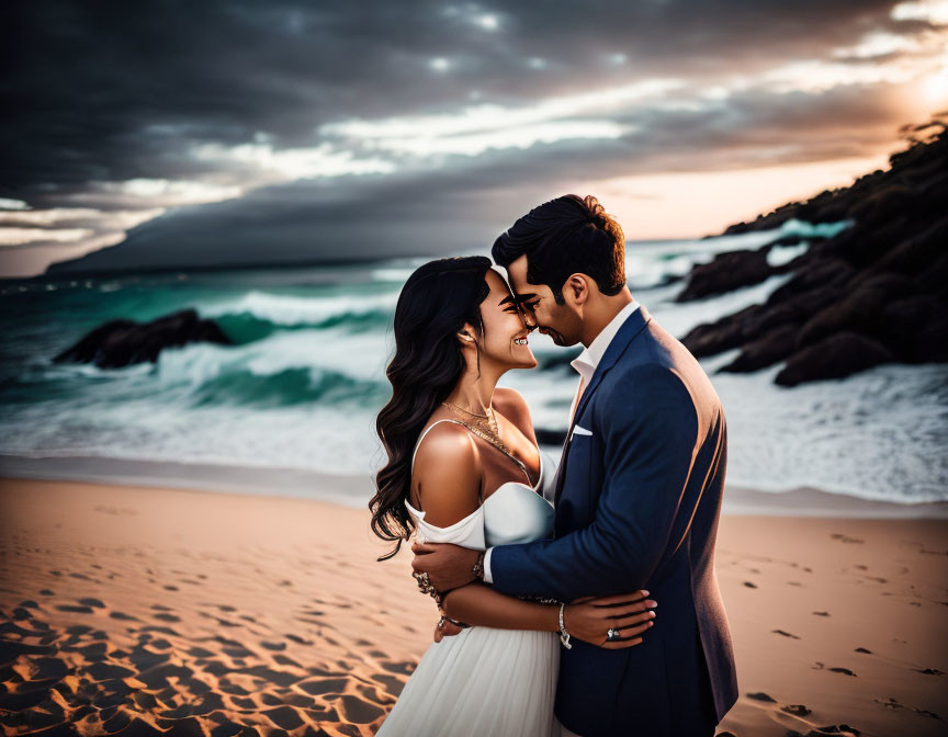 Couple Embracing on Beach at Dusk with Dramatic Sky