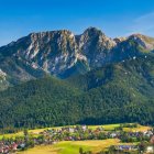 Panoramic Mountain Landscape with Rocky Cliffs and Verdant Valley