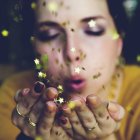 Colorful painting of woman with gold coins and glitter, blue accents