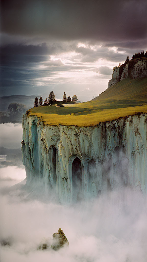 Dramatic icy cliff under cloudy sky with sparse trees