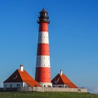 Lighthouse illustration on seaside cliff at night