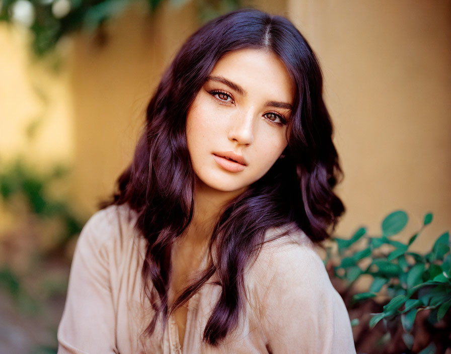 Portrait of Woman with Long Wavy Hair and Striking Eyes