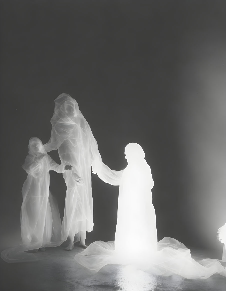 Ethereal white figures in dark space holding hands