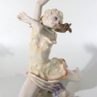 Ethereal figure in cream dress dances gracefully