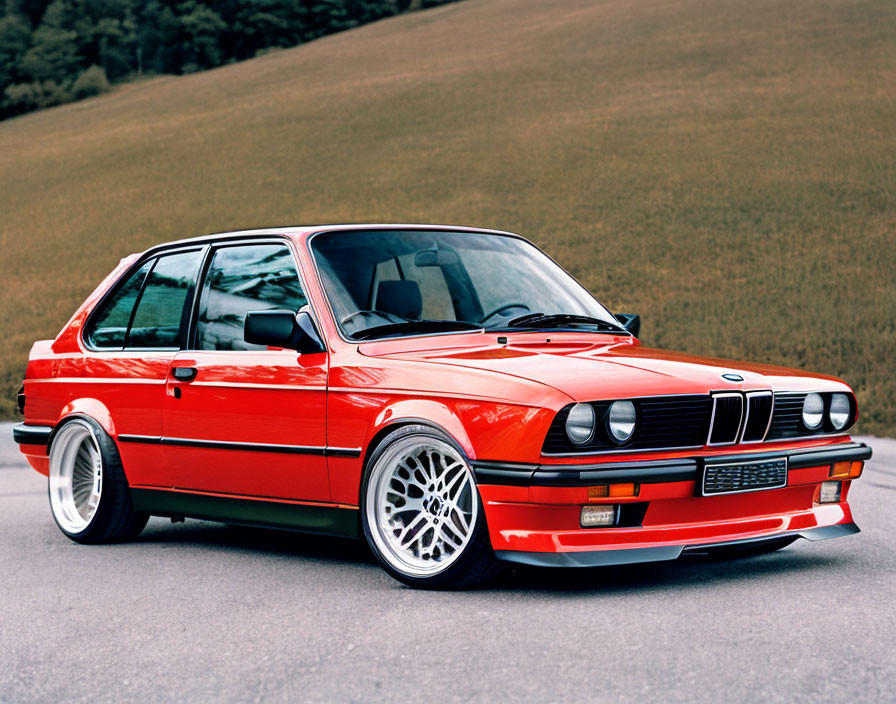 Red BMW E30 M3 with White Rims on Asphalt Road