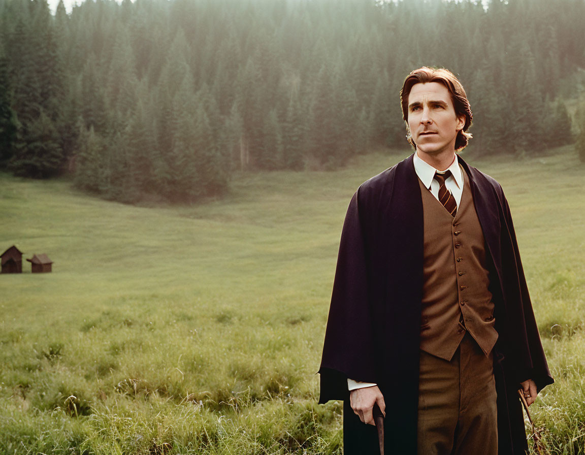 Man in 19th-Century Attire Contemplating in Meadow