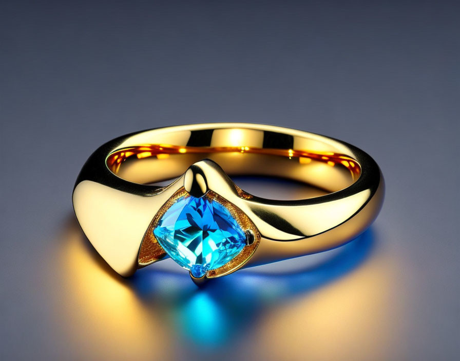 Gold Ring with Blue Gemstone: Elegant Illuminated Jewelry on Reflective Surface