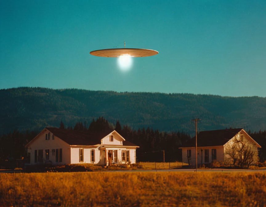 Unidentified flying object shines light over rural houses at dusk