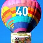 Colorful Hot Air Balloon with Number 40 Attached to Whimsical Caravan