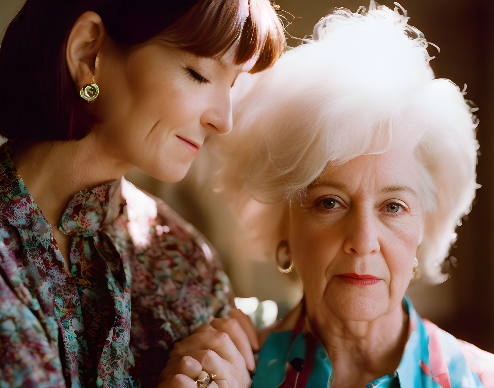 Generational bond between two women with dark and white hair