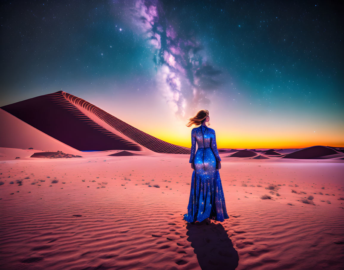 Woman in blue starry dress under Milky Way in desert twilight