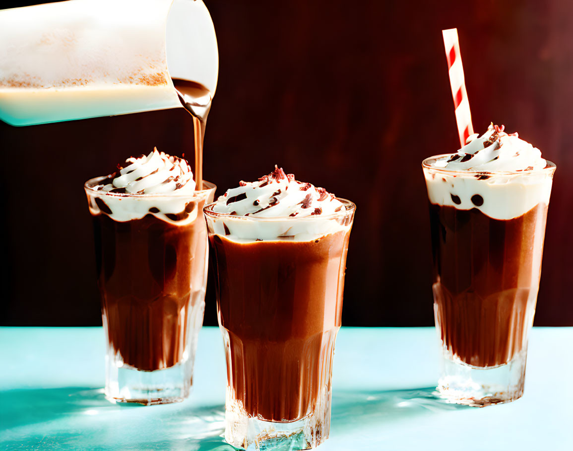 Chocolate Milkshake with Whipped Cream and Sprinkles in Two Glasses