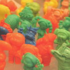 Assorted small plastic toy figures: characters with helmets and animals