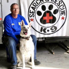 Police Officer with K-9 Partner and Paw Print Badge in Vigilant Pose