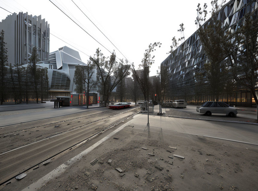 Deserted urban street with tram tracks and modern buildings.