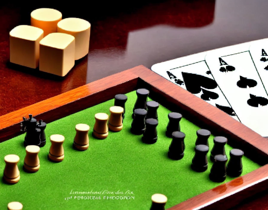 Assorted game pieces on vibrant green table surface