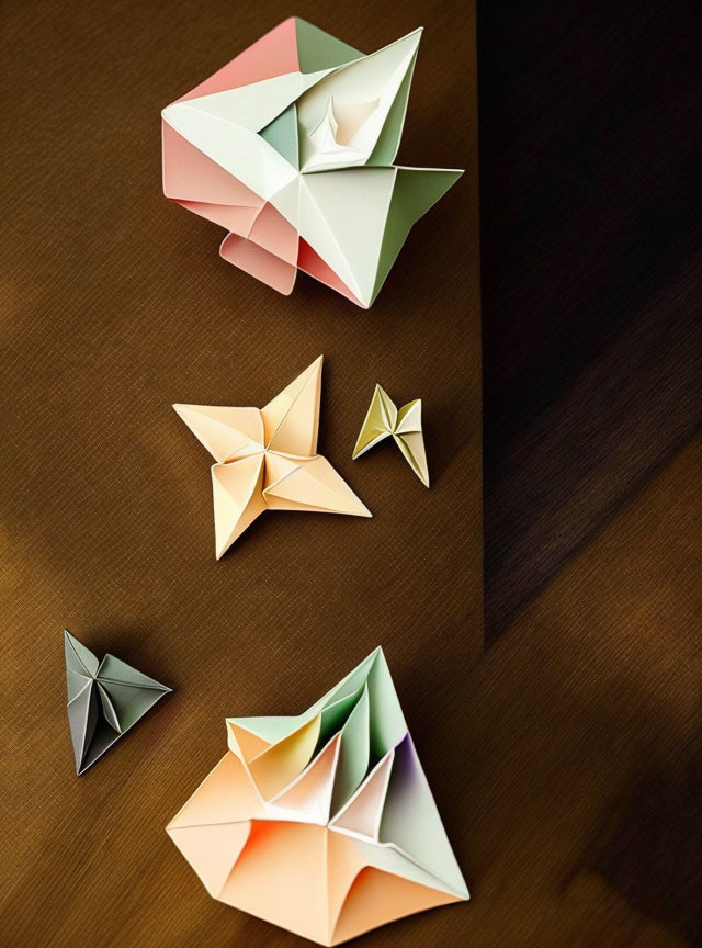 Colorful Paper Origami Models on Wooden Surface with Shadows and Geometric Shapes