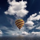 Colorful hot air balloons over serene sea at dusk