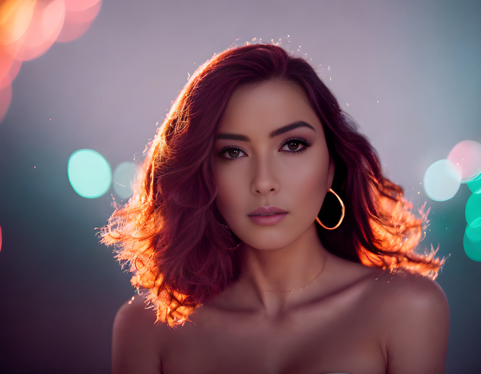 Auburn-Haired Woman with Gold Hoop Earrings and Bokeh Lights