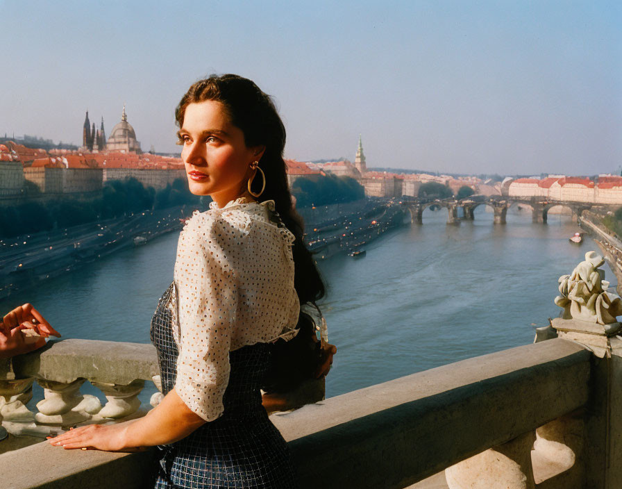 Vintage Attired Woman on Bridge Overlooking River and Cityscape