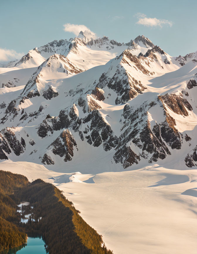 Majestic snow-covered mountain peaks and frozen lake scenery