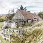 Colorful tin roof rustic house in serene landscape with water reflection.