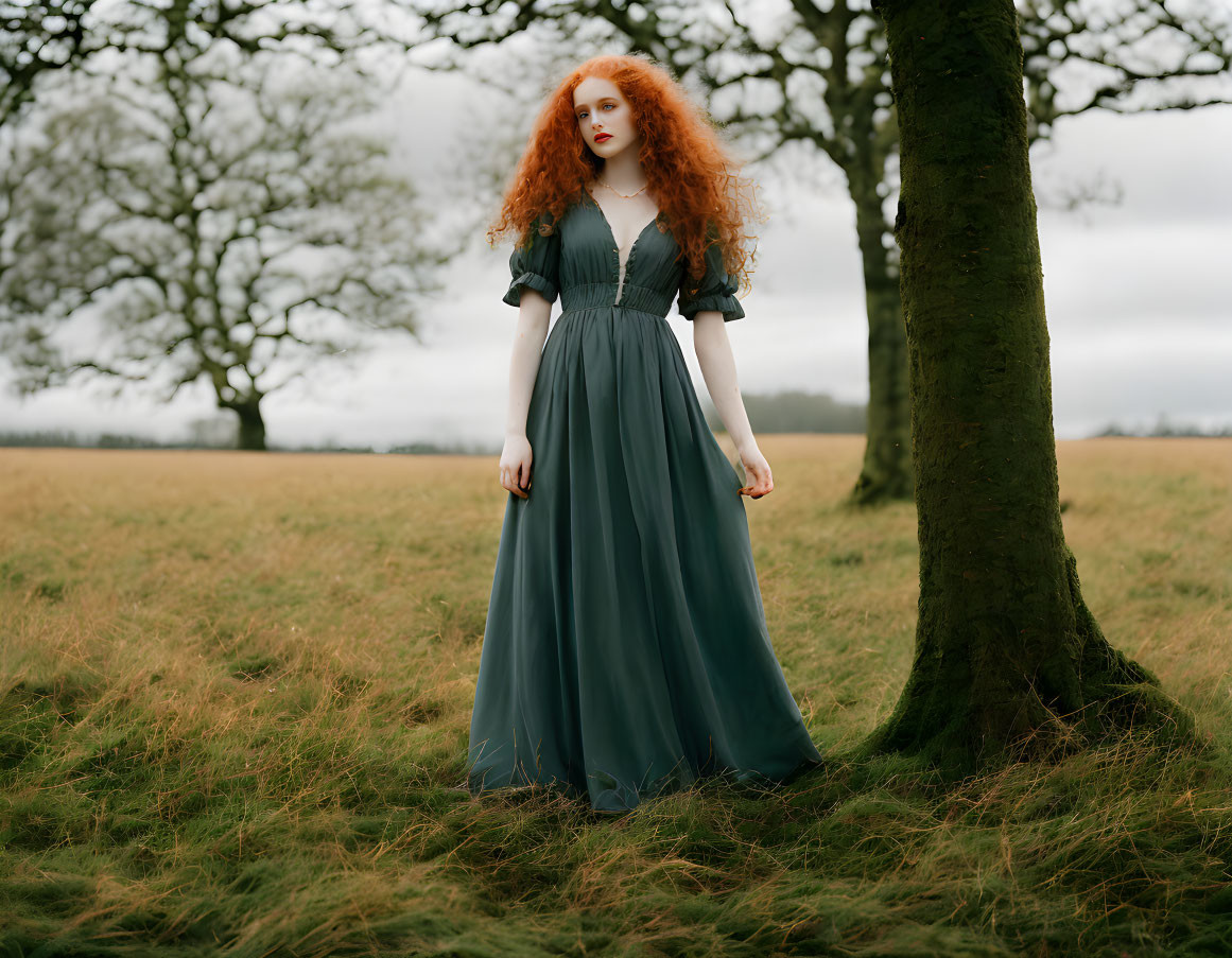 Curly Red-Haired Woman in Green Dress Standing in Field