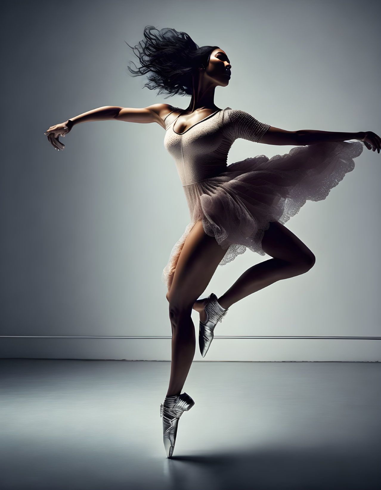 Dynamic ballet dancer on pointe with flowy hair and translucent tutu