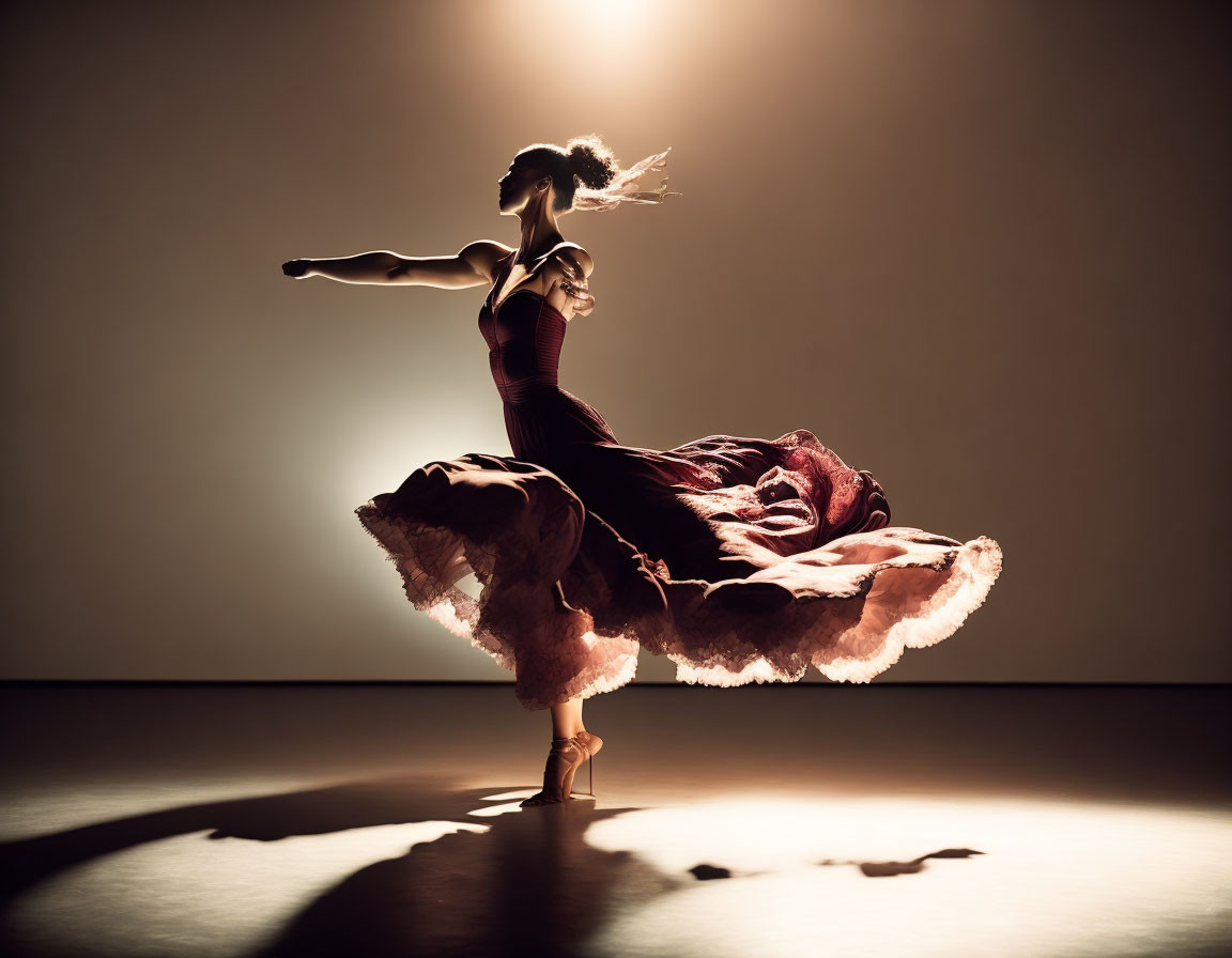 Elegant dancer mid-twirl with dramatic back-lighting