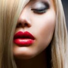 Blonde Woman Close-Up with Pink Lipstick & Smoky Eyeshadow