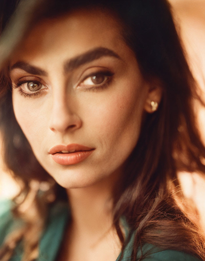 Intense gaze portrait of a woman with prominent eyebrows and full lips