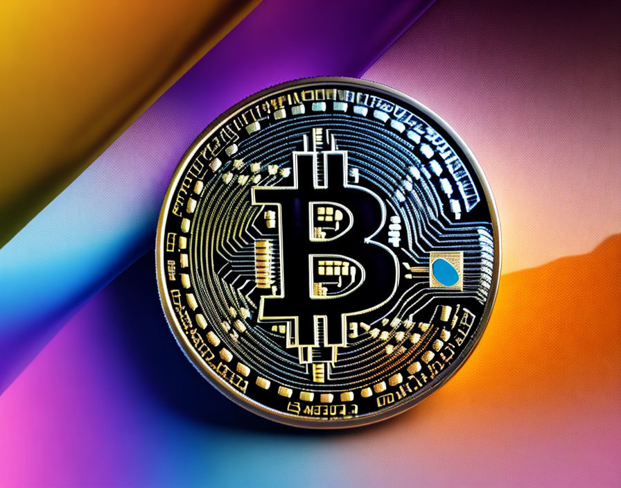 Reflective Physical Bitcoin Token on Multicolored Background