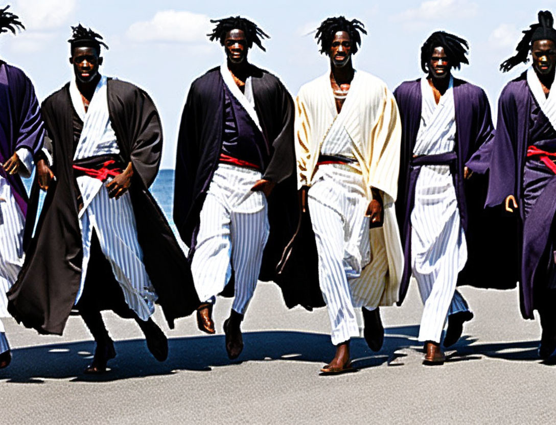 Group in Traditional Japanese Attire Running by Sunny Coastal Area