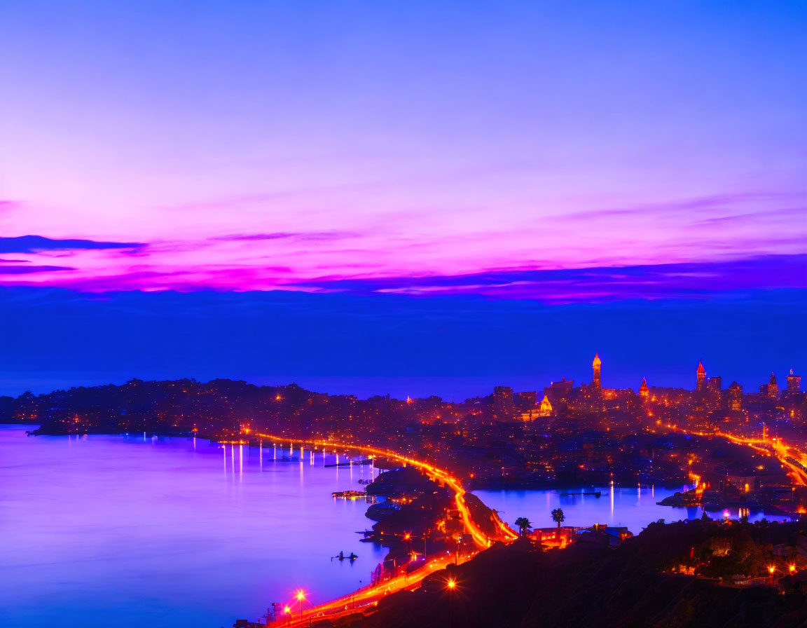 Vibrant purple and blue twilight cityscape overlooking coastal city with illuminated buildings and bridge