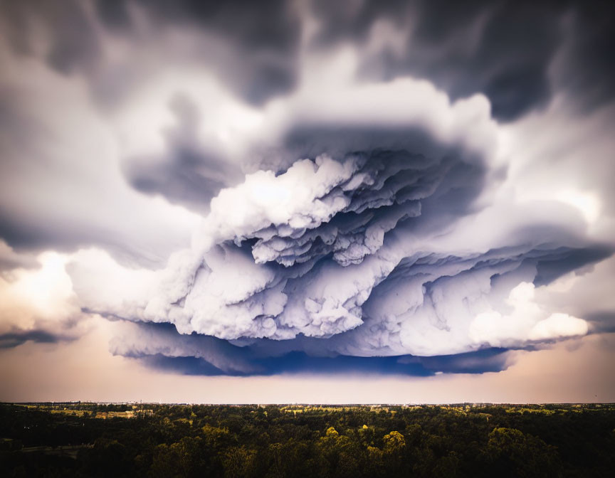 Dramatic Dark Storm Cloud Over Tranquil Landscape