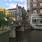 Vibrant gondolas on serene canal with European buildings at sunset