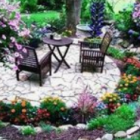 Colorful Garden with Mosaic Path, Flowers, Pond, and Sitting Area