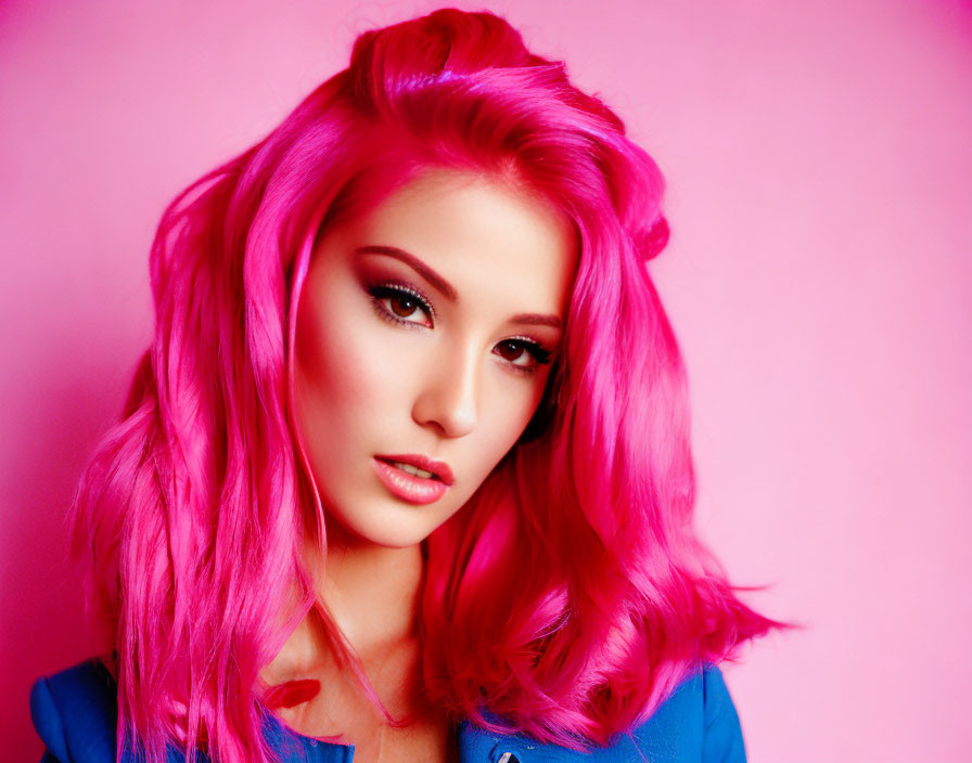 Bright Pink Hair and Makeup on Serious Person against Pink Background