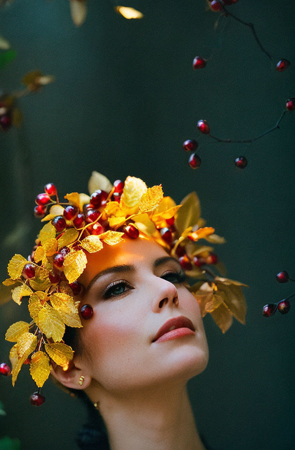 Woman with Yellow Leaf Wreath and Red Berries on Dark Background