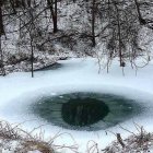 Futuristic vehicle hovers over frozen lake with autumn forest backdrop