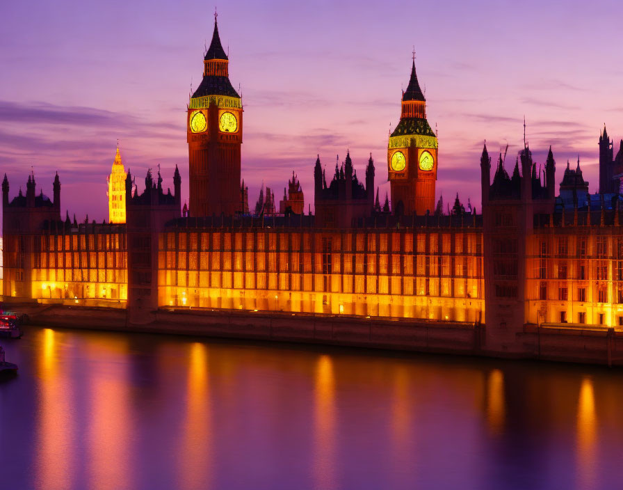 Twilight view of Palace of Westminster with Big Ben clock tower by River Thames