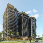 High-rise buildings with green balconies under clear sky