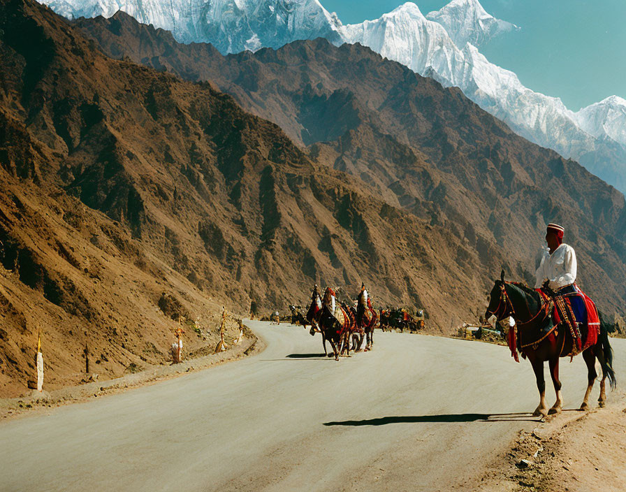 Traditional Attire Person on Horseback Mountain Road Scene