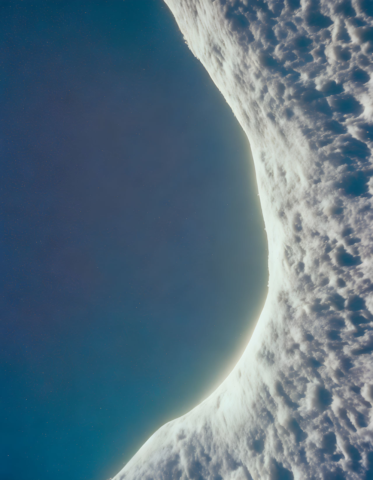 Curved Earth horizon under soft sun glow