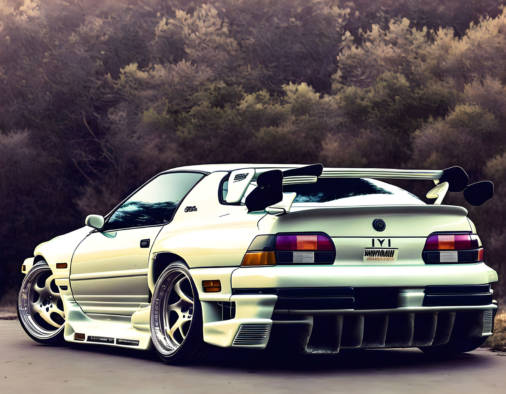 Modified white Toyota Supra with large rear wing against blurred nature backdrop