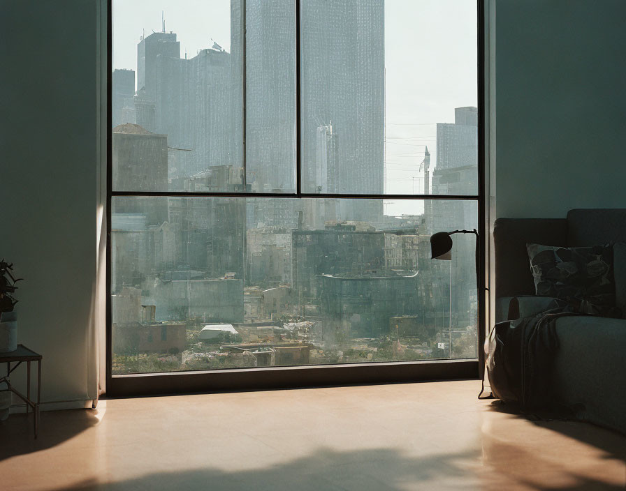 Spacious room with city view window, couch, lamp, and plants