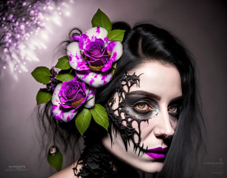 Dark-haired woman with gothic makeup and black lace, wearing purple roses and green leaves in her hair