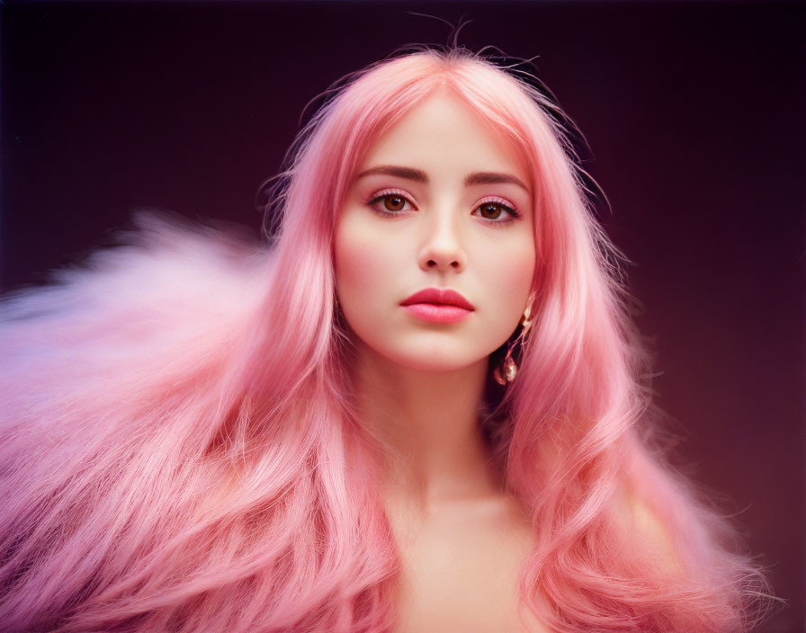 Portrait of person with pastel pink hair and fair skin on purplish backdrop