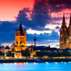 European-style architecture skyline at sunset with domes and towers reflected in water