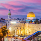 Vibrant painting of a Middle Eastern village at dusk with golden-domed buildings